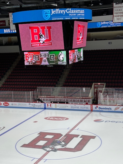 A hockey arena with a screen