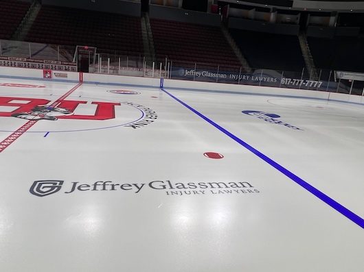 A hockey rink with a logo on it